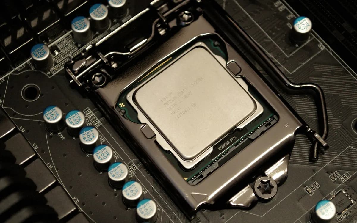 Close-up photograph of a processor seated in a desktop motherboard socket.
